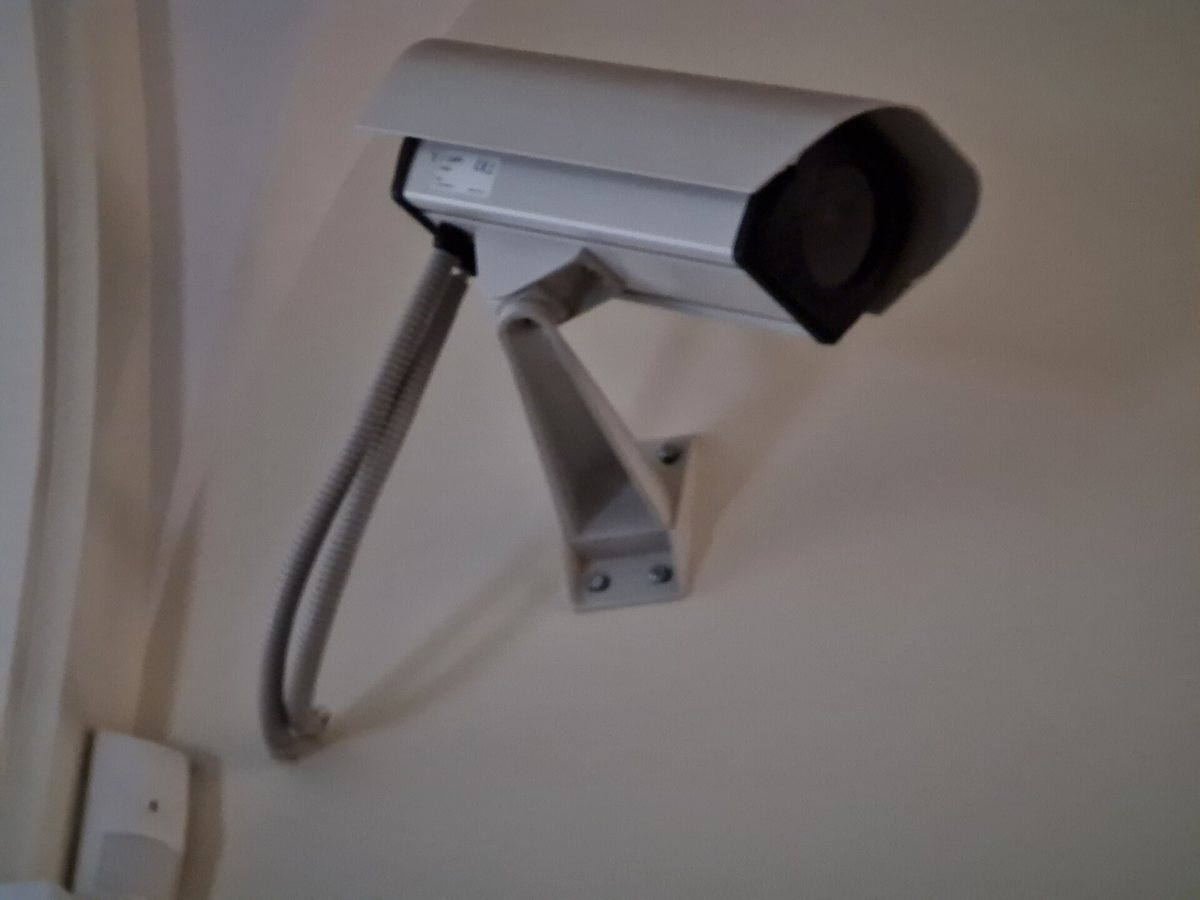 CCTV security camera mounted on wall